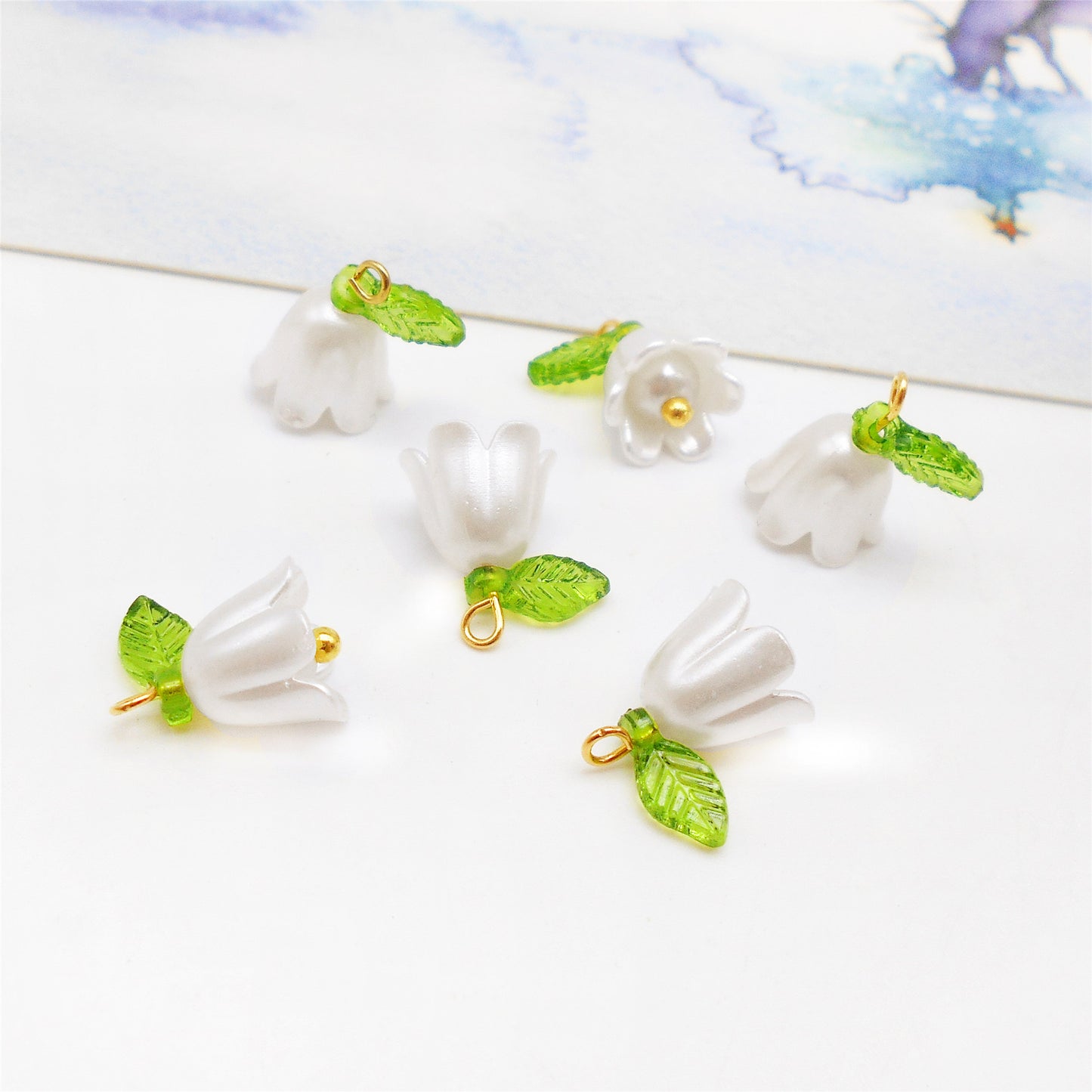 10PCS 14*14mm White Plastic Bell Flower Charms with Green Acrylic Leaf, Handmade Floral Dangles for Pendant Jewelry Making DIY Necklace Bracelet Crafts Supplies